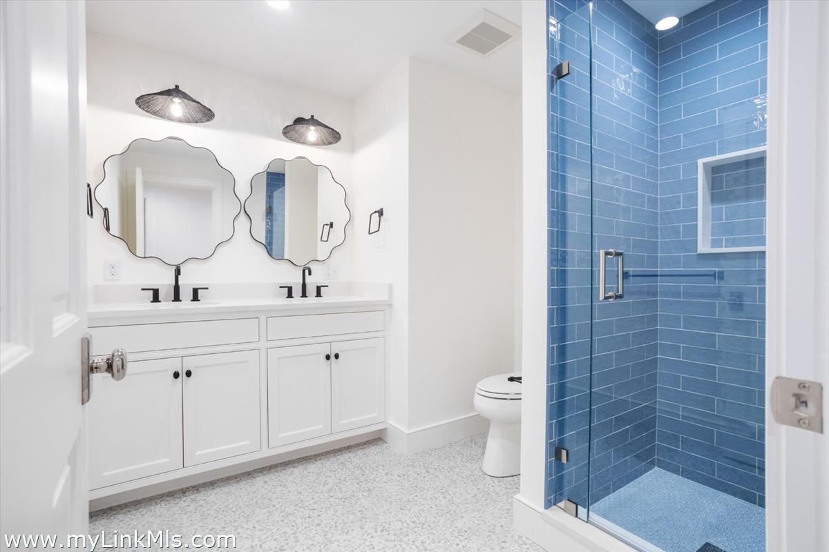 22 Vestal Street Nantucket, MA 02554 - Photo 43 of 43 a bathroom with a double vanity sink mirror and toilet