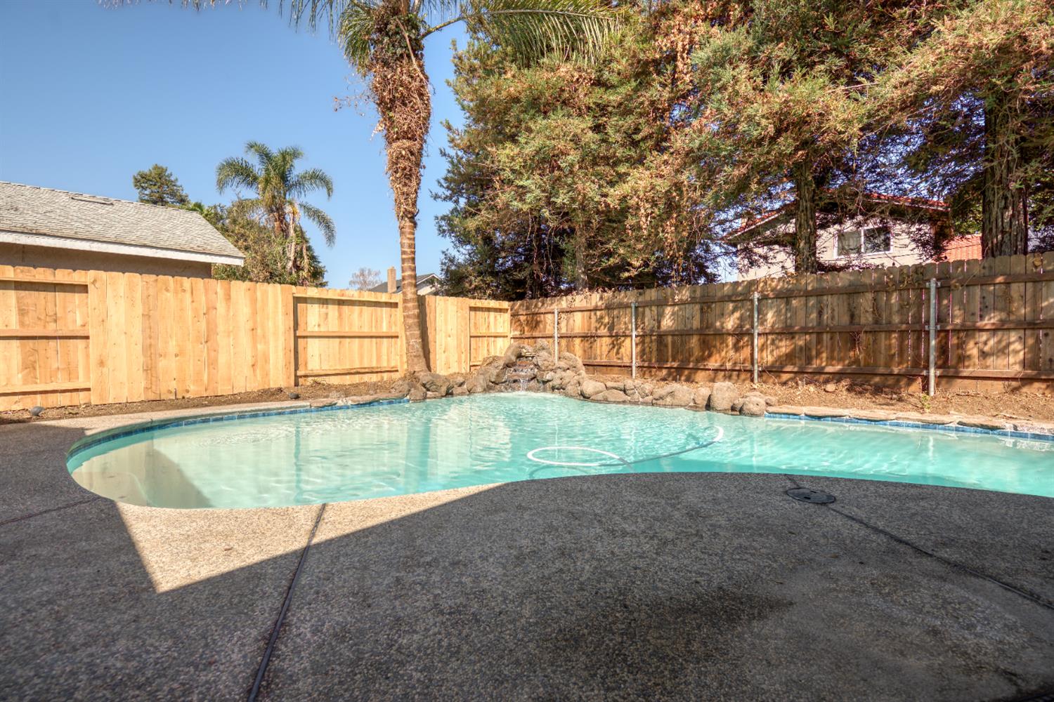 1621 Davis Street Ripon, CA 95366 - Photo 5 of 43 view of pool featuring a fenced backyard