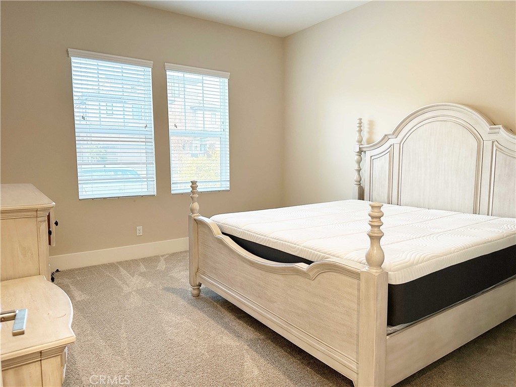 58 Ray Irvine, CA 92618 - Photo 14 of 35 a bed sitting in a bedroom next to a window