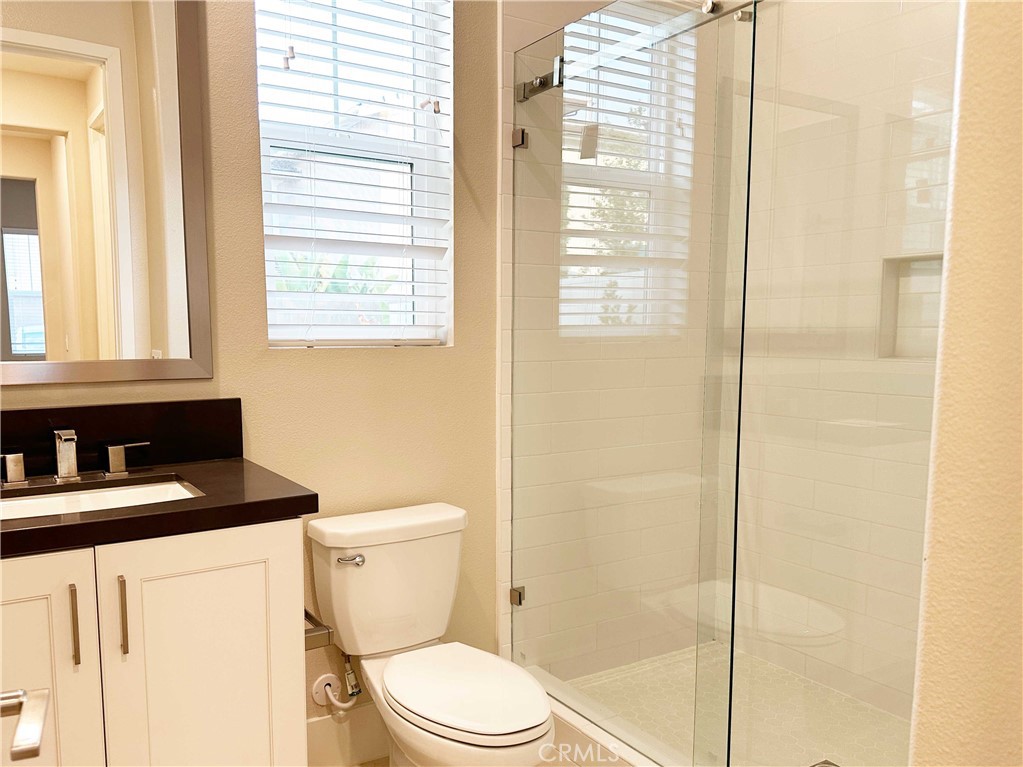 58 Ray Irvine, CA 92618 - Photo 16 of 35 a bathroom with a toilet a sink and a shower