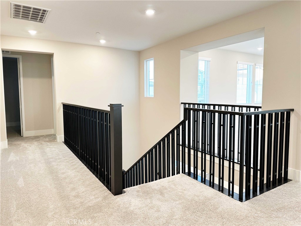 58 Ray Irvine, CA 92618 - Photo 17 of 35 a view of a hallway with wooden floor