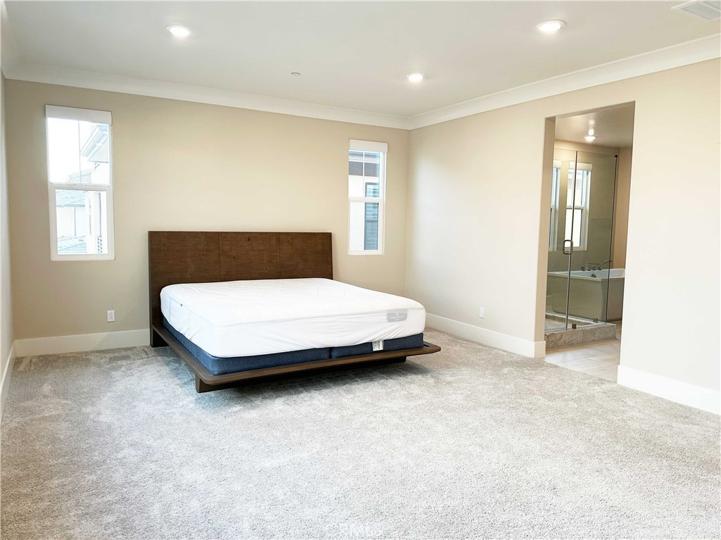 58 Ray Irvine, CA 92618 - Photo 22 of 35 a bedroom with a bed and a table in it