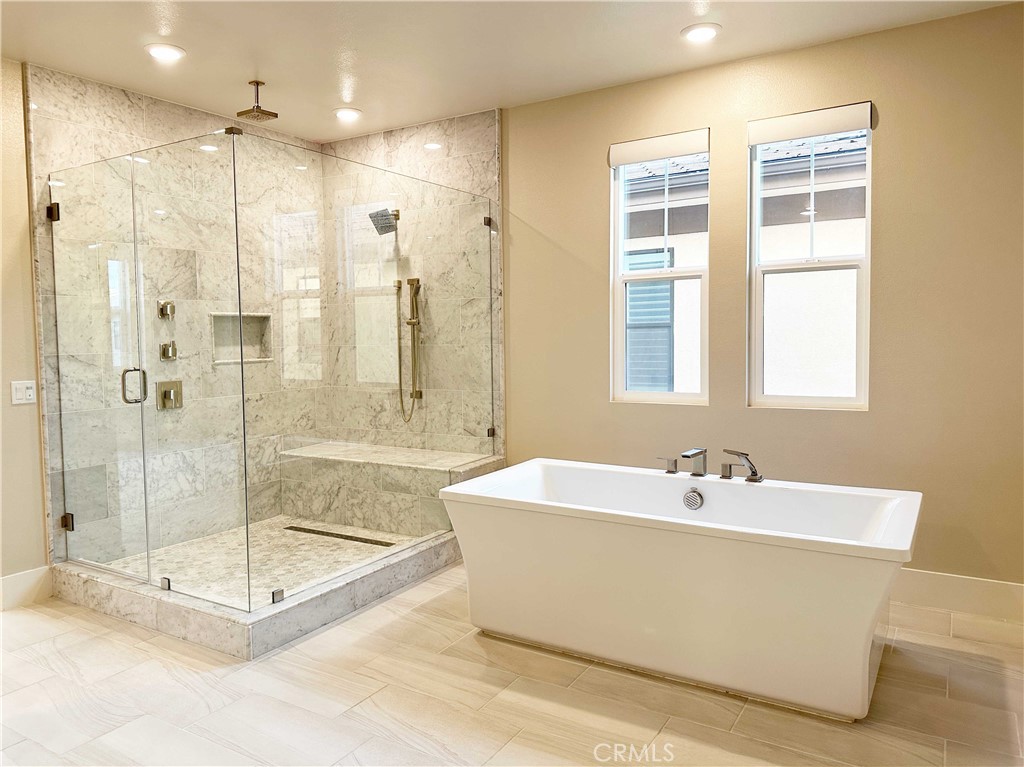 58 Ray Irvine, CA 92618 - Photo 26 of 35 a spacious bathroom with a tub shower and sink