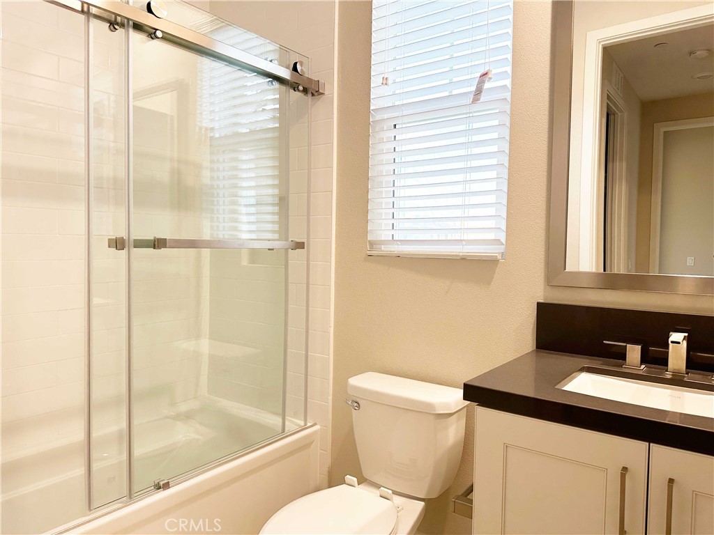 58 Ray Irvine, CA 92618 - Photo 29 of 35 a bathroom with a granite countertop sink toilet and shower