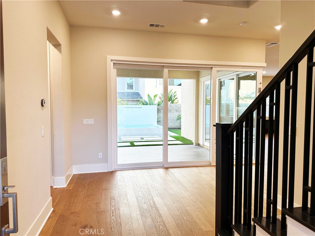 58 Ray Irvine, CA 92618 - Photo 3 of 35 a view of an entryway with wooden floor