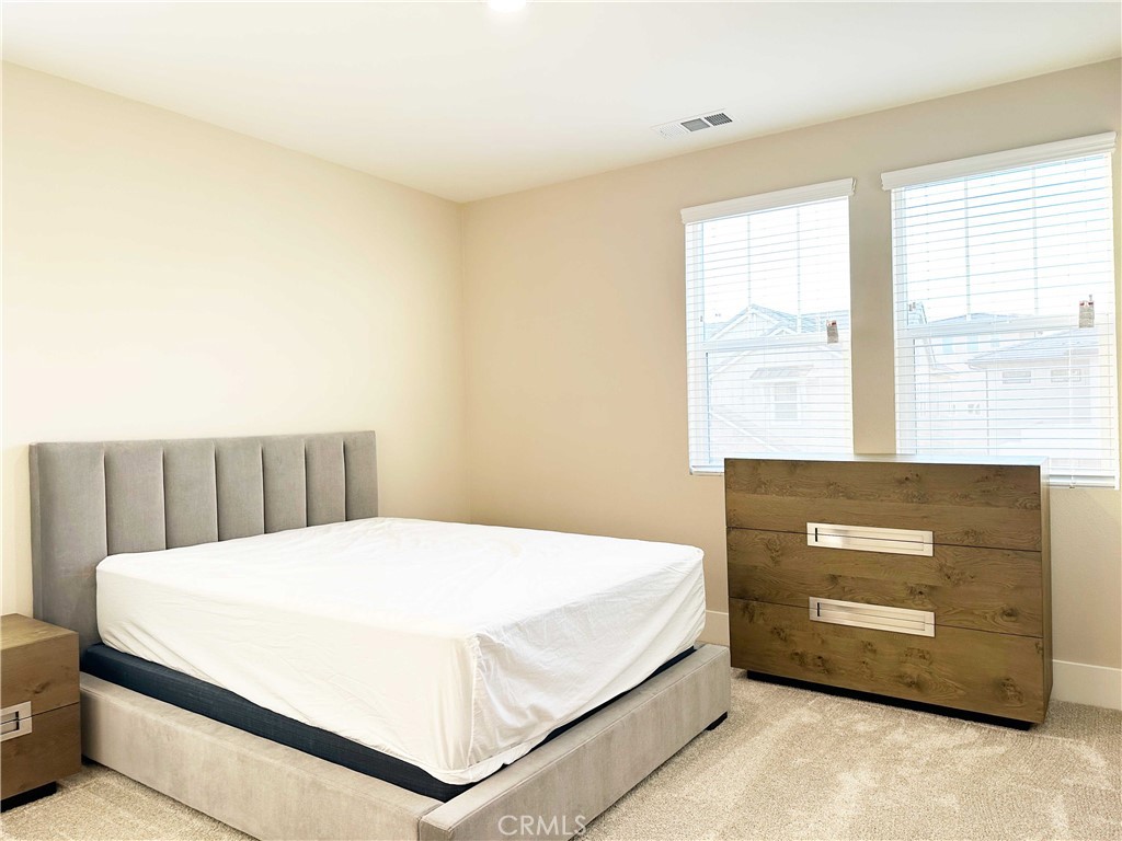 58 Ray Irvine, CA 92618 - Photo 32 of 35 a bedroom with a bed and window