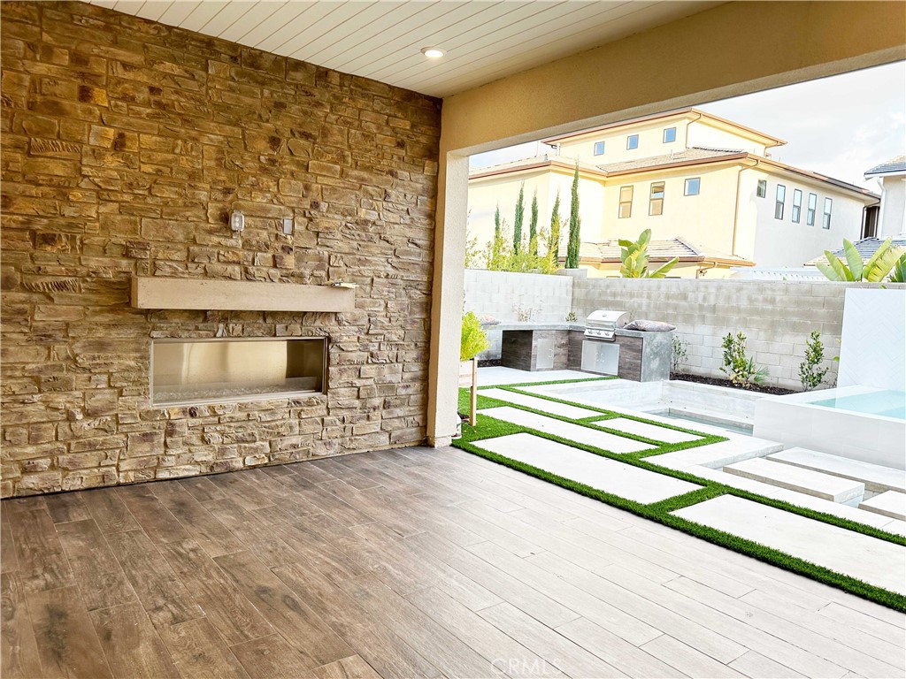 58 Ray Irvine, CA 92618 - Photo 34 of 35 a living room with a fireplace and a floor to ceiling window