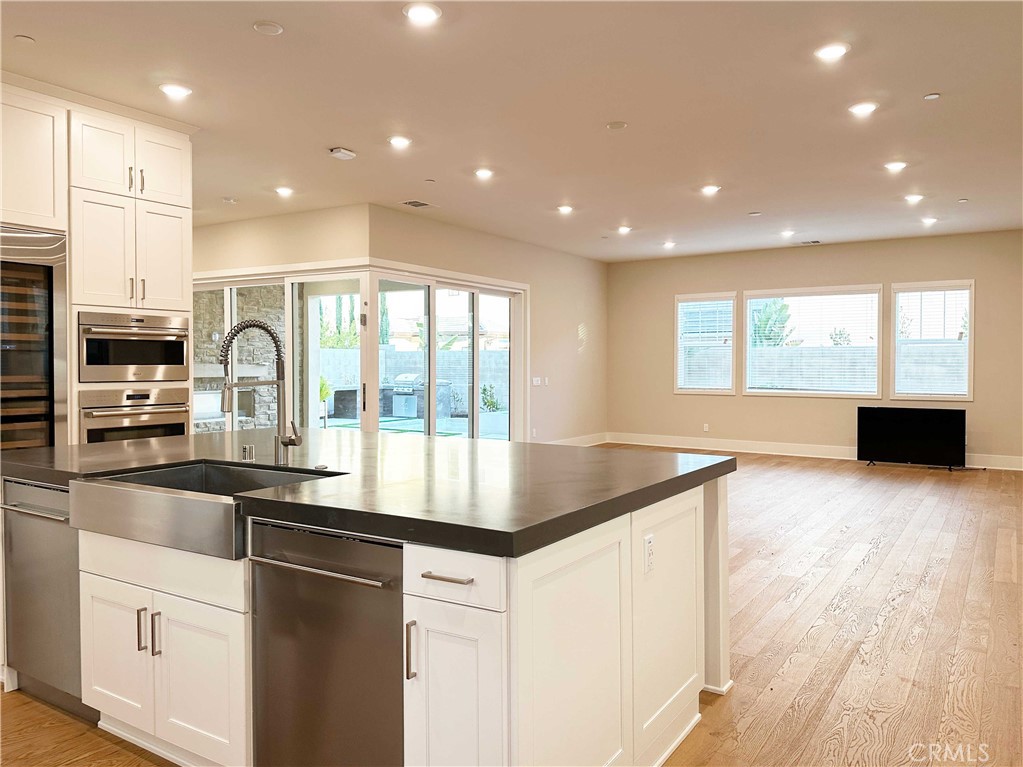 58 Ray Irvine, CA 92618 - Photo 9 of 35 a kitchen with kitchen island granite countertop a stove and a sink