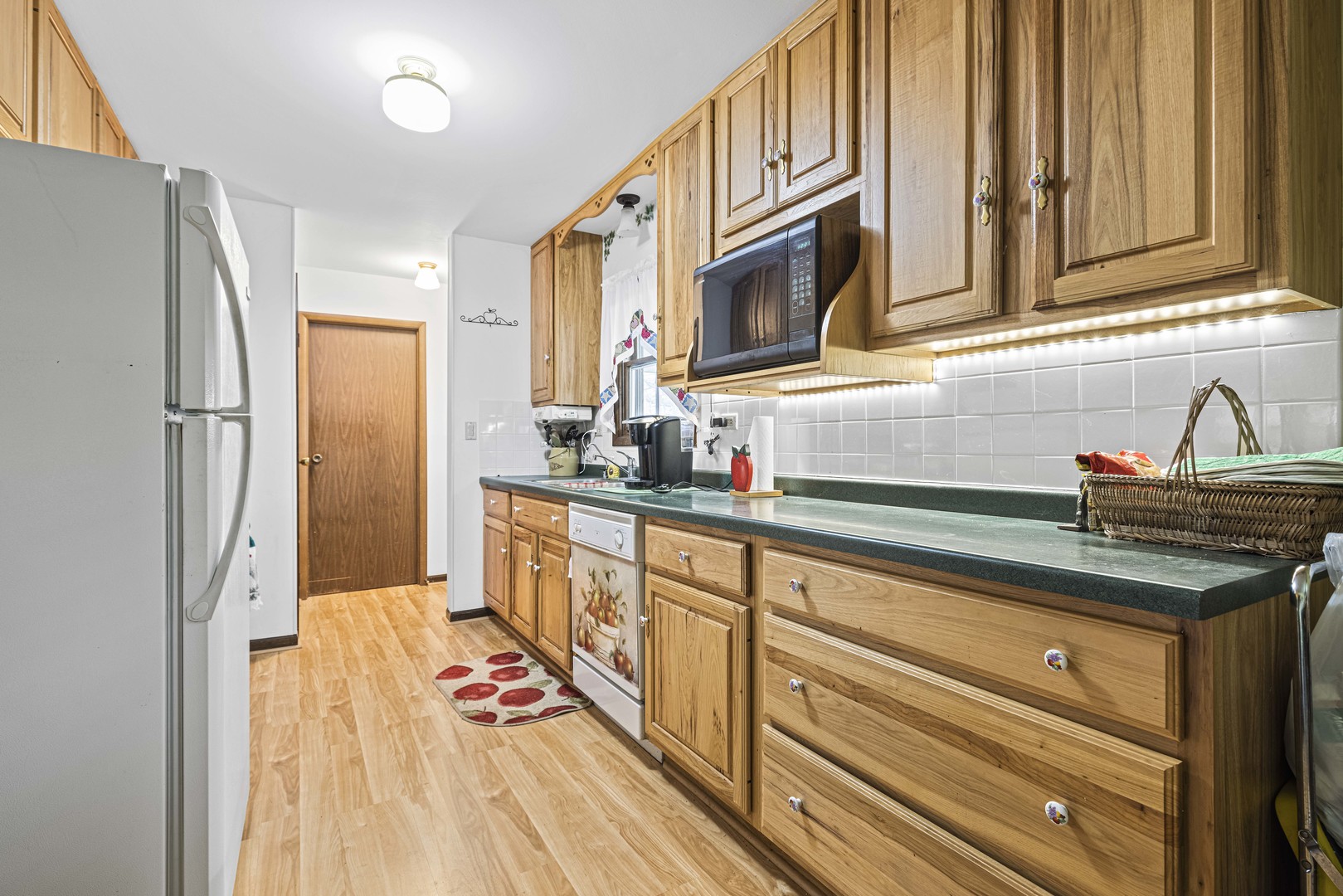 18567 Stevens Road Marengo, IL 60152 - Photo 6 of 18 a kitchen with stainless steel appliances granite countertop a refrigerator and a sink