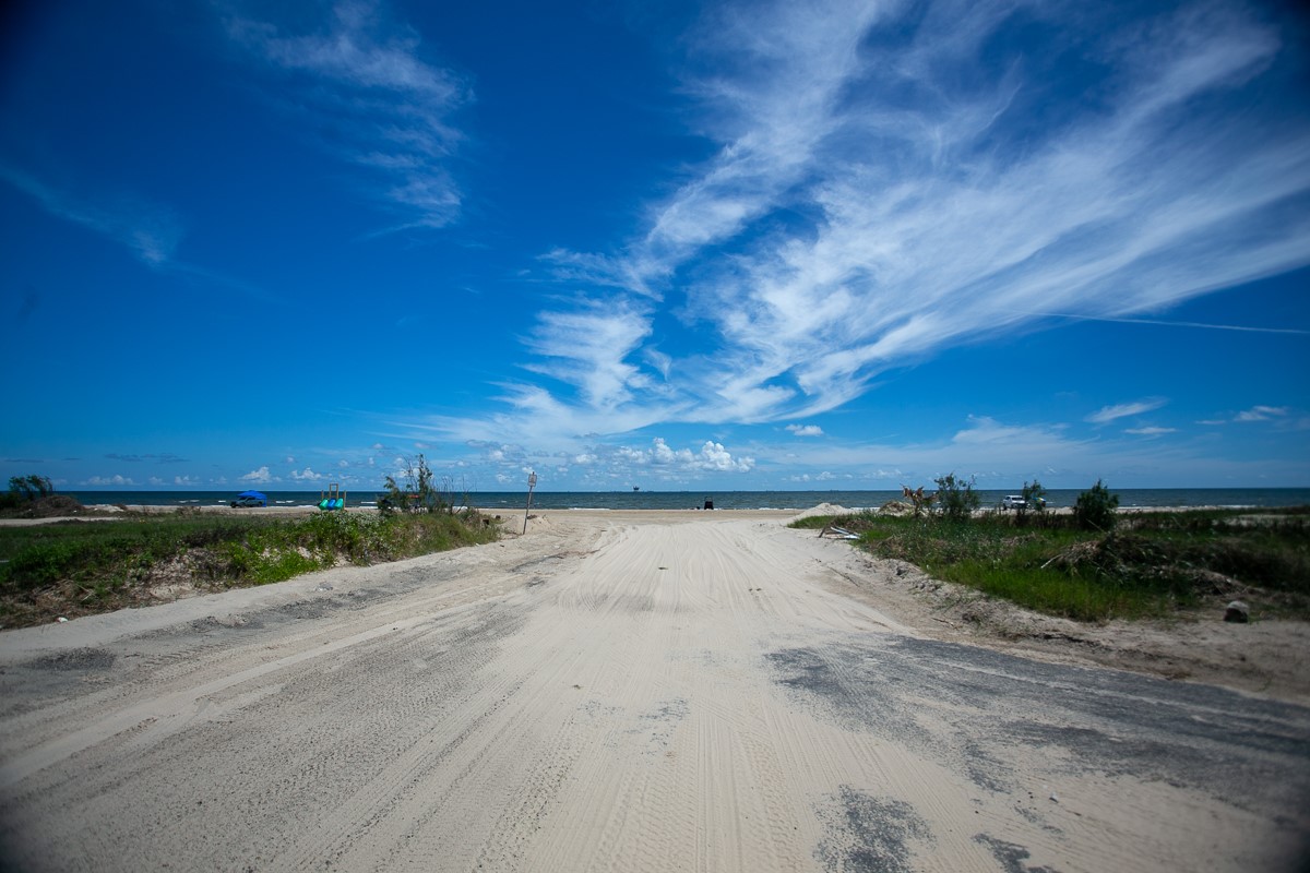 959 South East Road Crystal Beach, TX 77650 - Photo 7 of 20 a view of an ocean beach and mountain