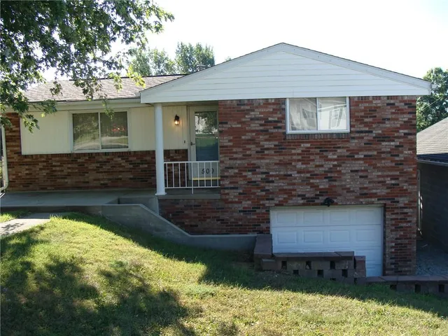 a front view of a house with yard