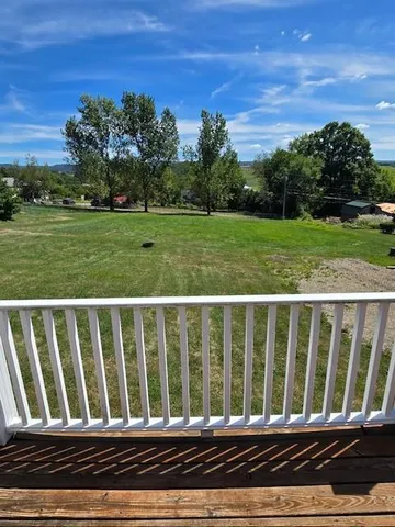 a view of porch with a yard