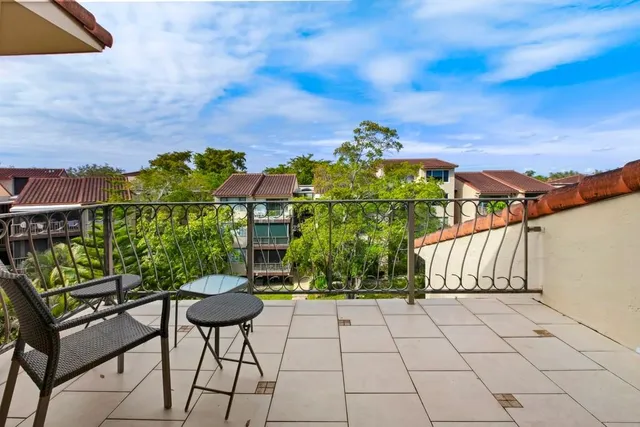 a view of a chairs and table on the terrace
