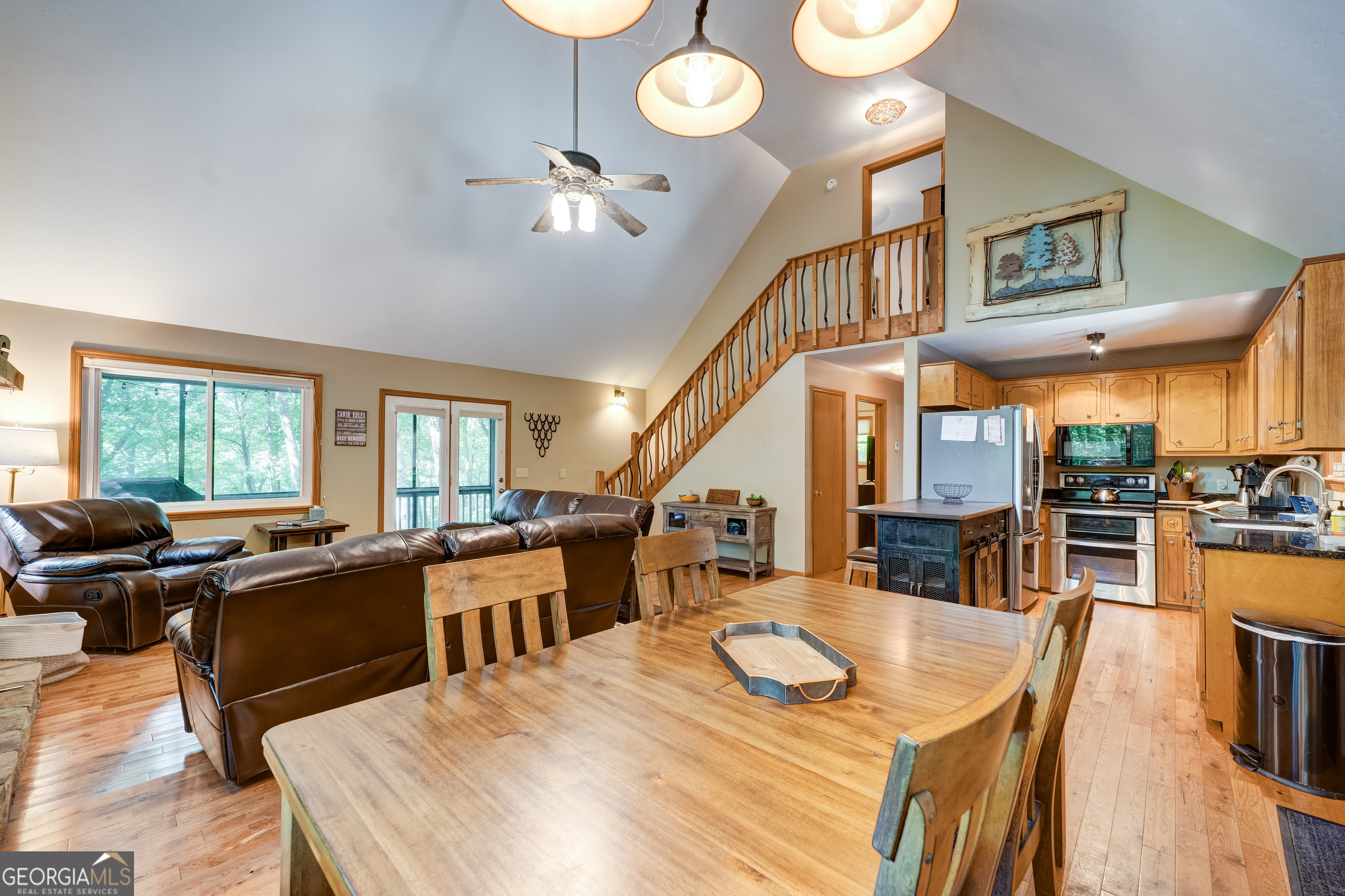 708 Wilson Mountain Road Blairsville, GA 30512 - Photo 14 of 48 a large kitchen with a table and chairs
