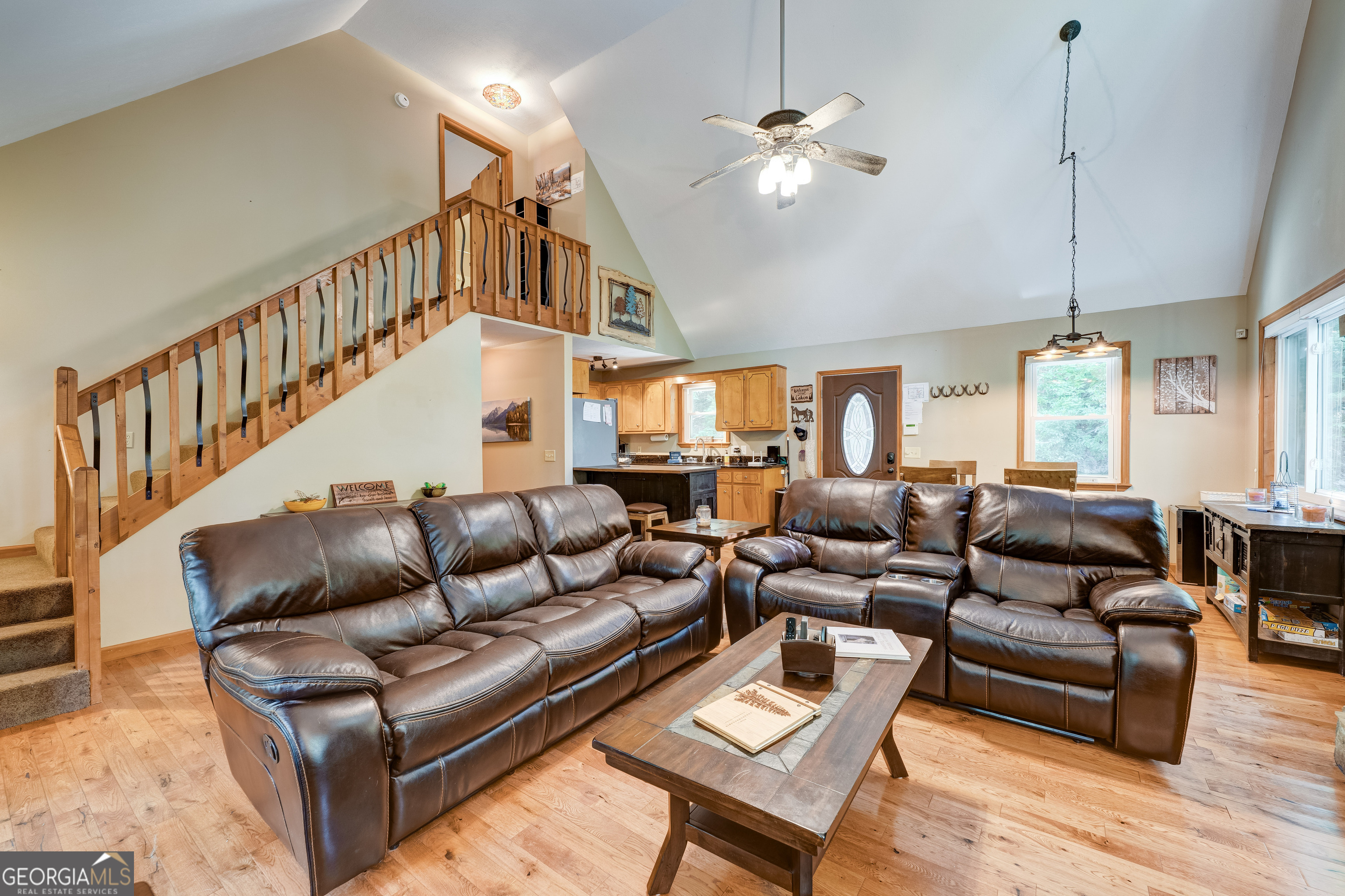 708 Wilson Mountain Road Blairsville, GA 30512 - Photo 15 of 48 a living room with furniture ceiling fan and a rug