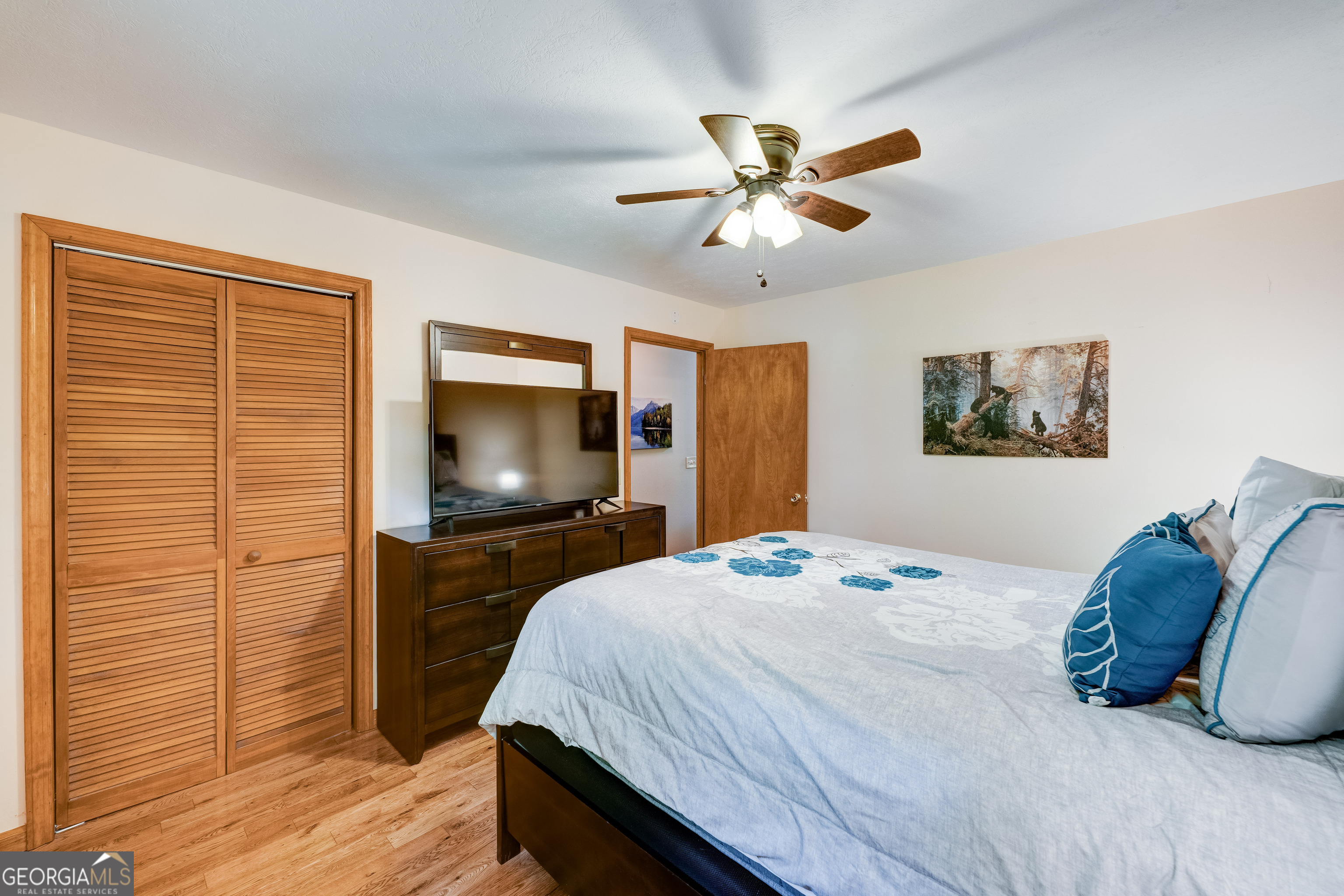 708 Wilson Mountain Road Blairsville, GA 30512 - Photo 19 of 48 a bedroom with a bed and a flat screen tv