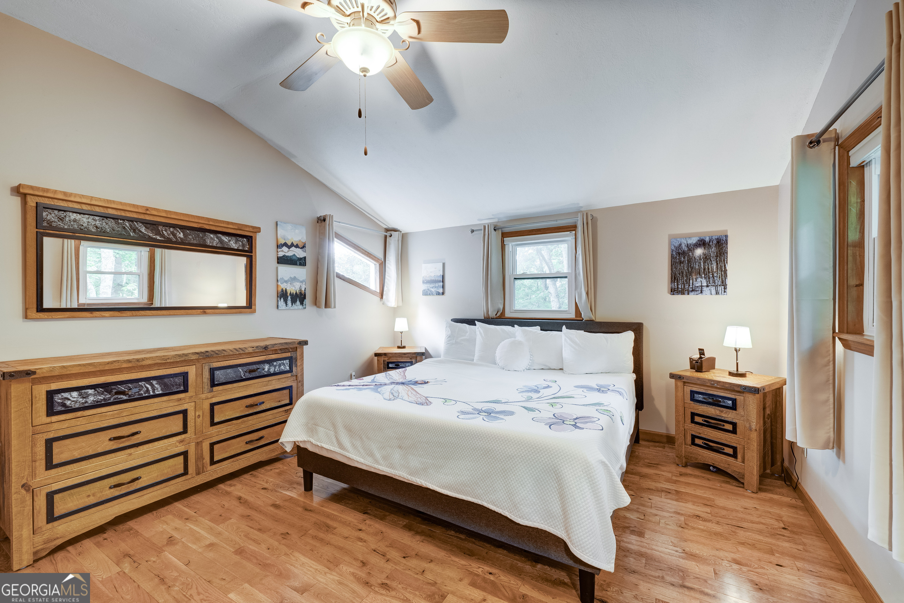 708 Wilson Mountain Road Blairsville, GA 30512 - Photo 25 of 48 a bedroom with a bed and a dresser