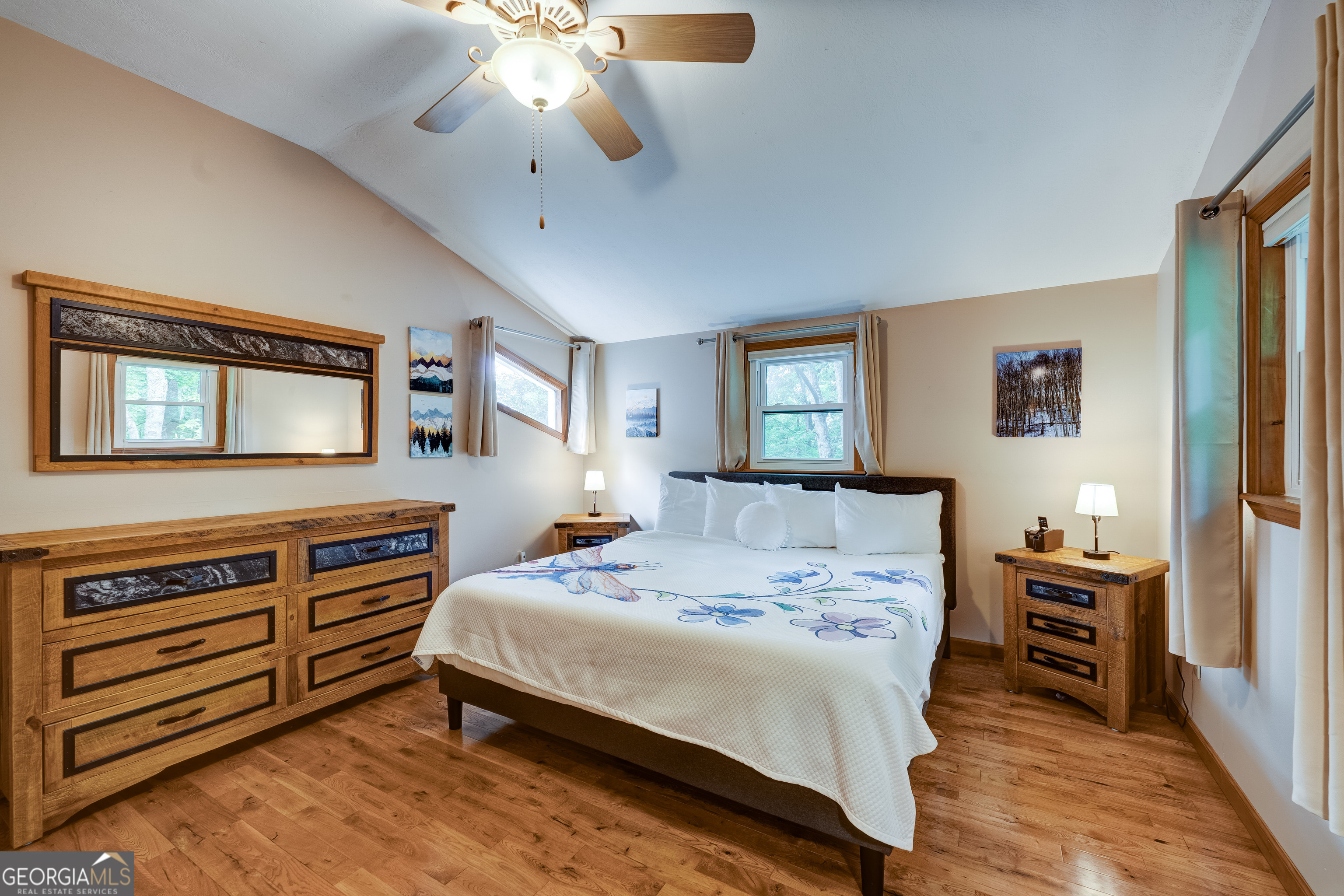 708 Wilson Mountain Road Blairsville, GA 30512 - Photo 26 of 48 a bedroom with a bed and a dresser