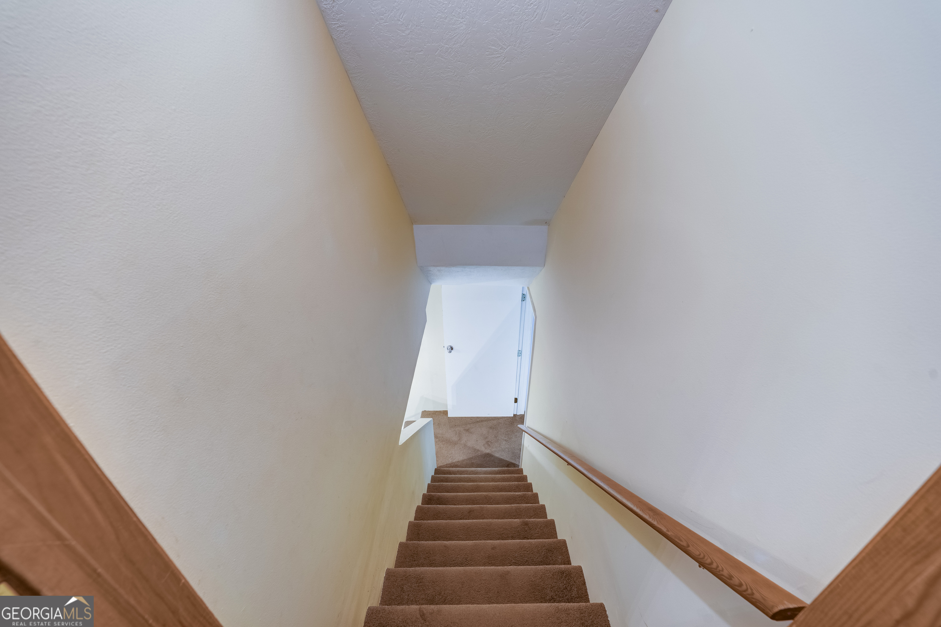 708 Wilson Mountain Road Blairsville, GA 30512 - Photo 29 of 48 a view of a hallway with stairs