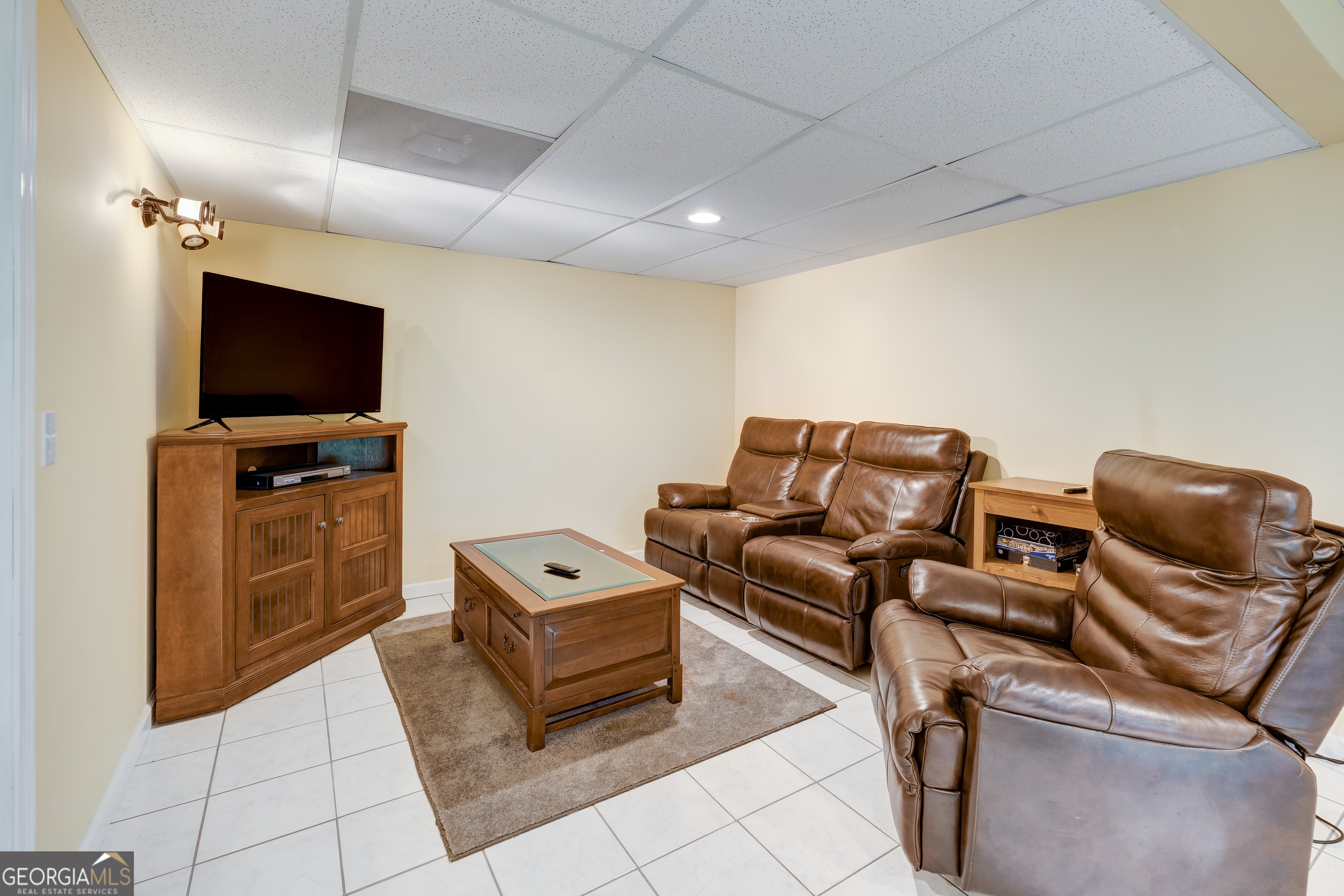 708 Wilson Mountain Road Blairsville, GA 30512 - Photo 32 of 48 a living room with furniture and a flat screen tv