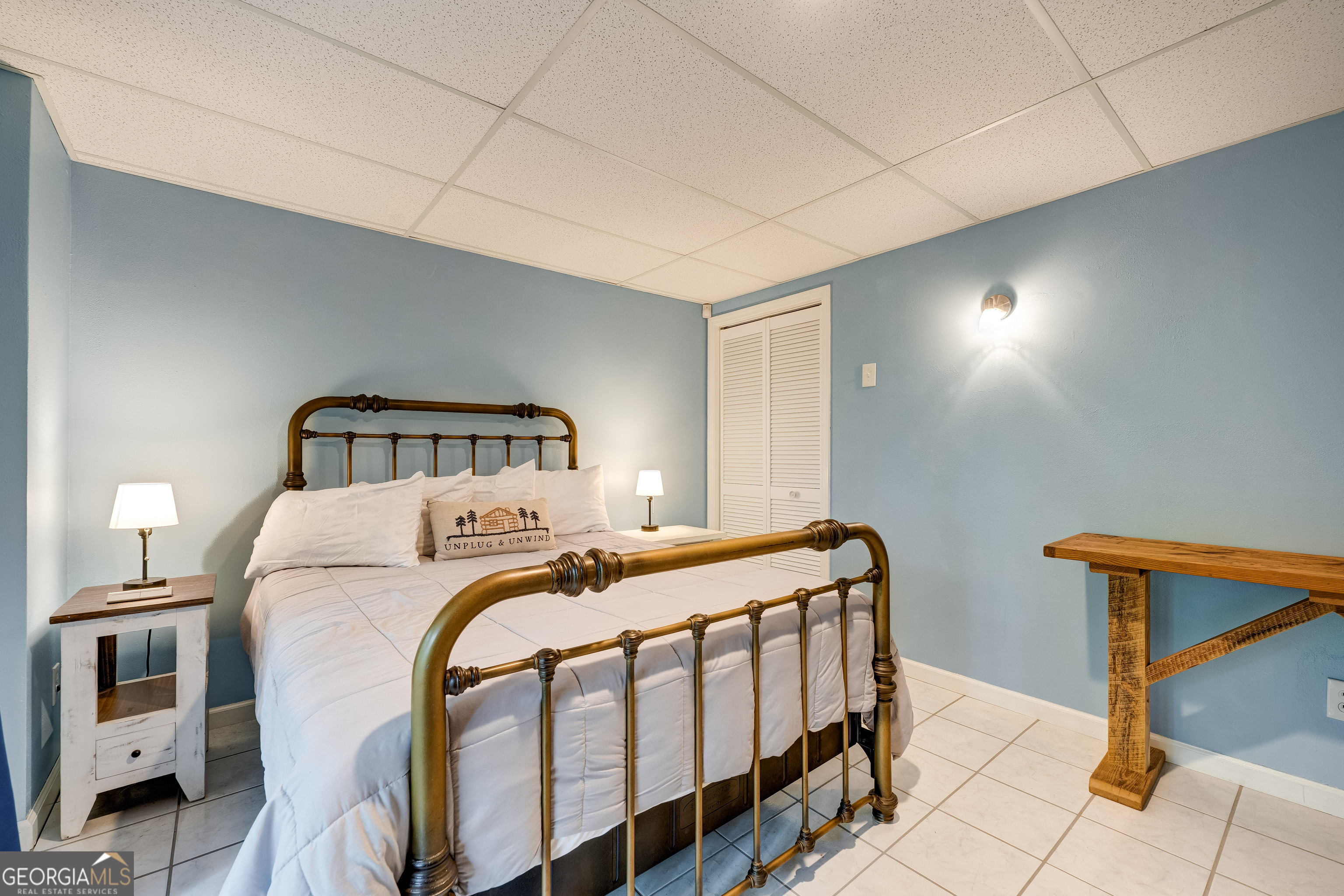 708 Wilson Mountain Road Blairsville, GA 30512 - Photo 34 of 48 a bedroom with a bed and a window