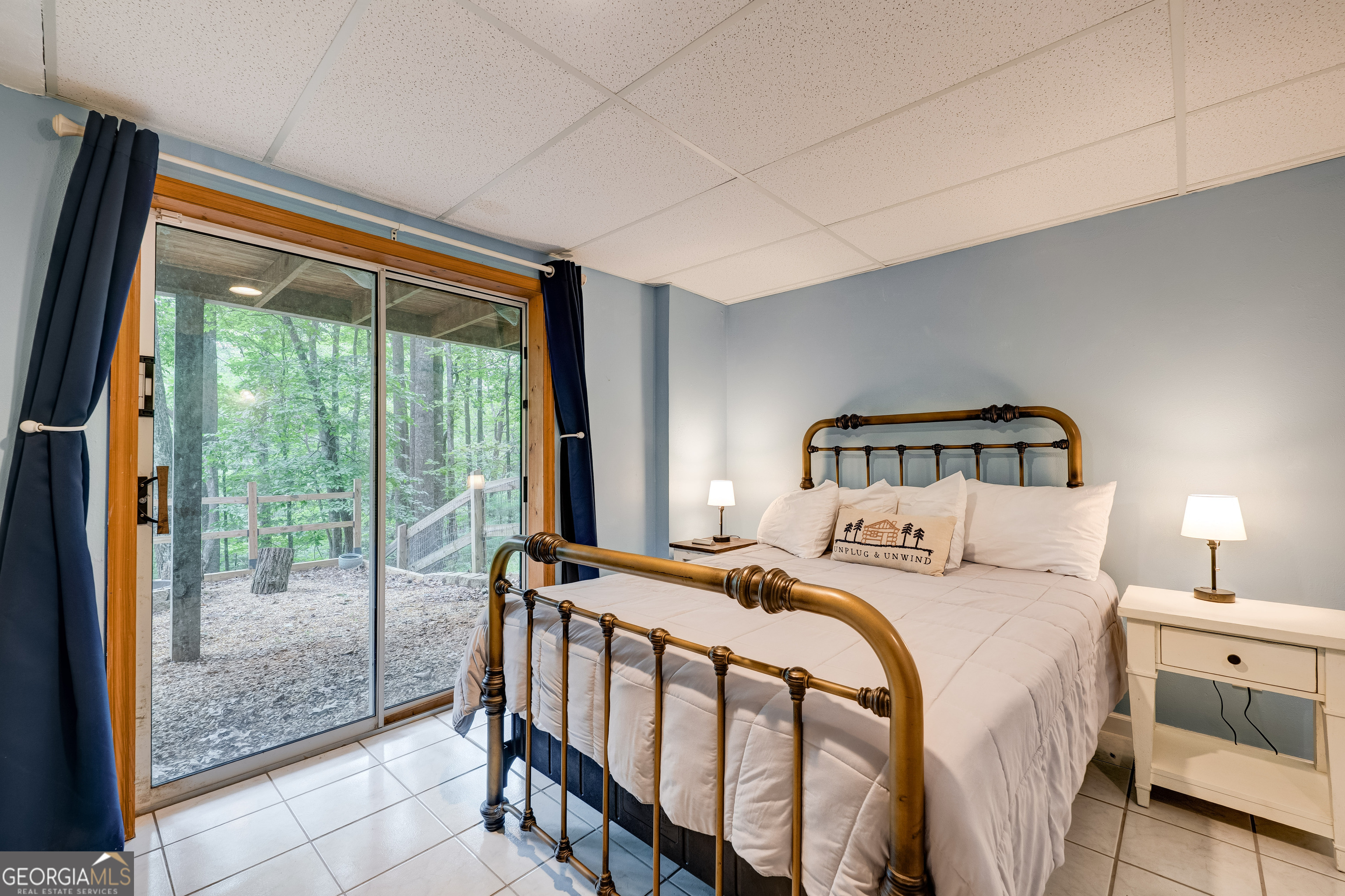 708 Wilson Mountain Road Blairsville, GA 30512 - Photo 35 of 48 a bedroom with a bed and a large window