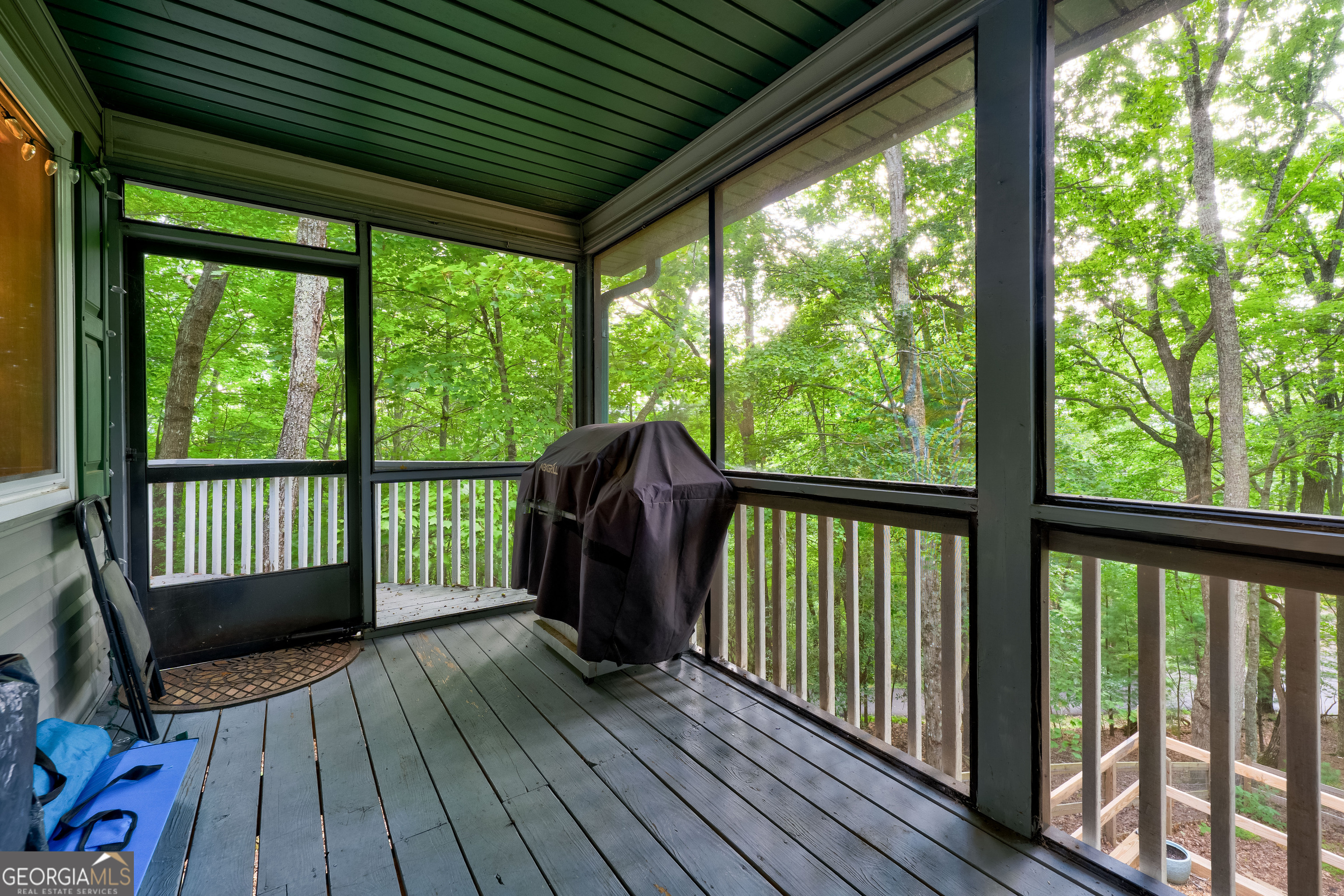 708 Wilson Mountain Road Blairsville, GA 30512 - Photo 41 of 48 a view of a two chairs in the balcony