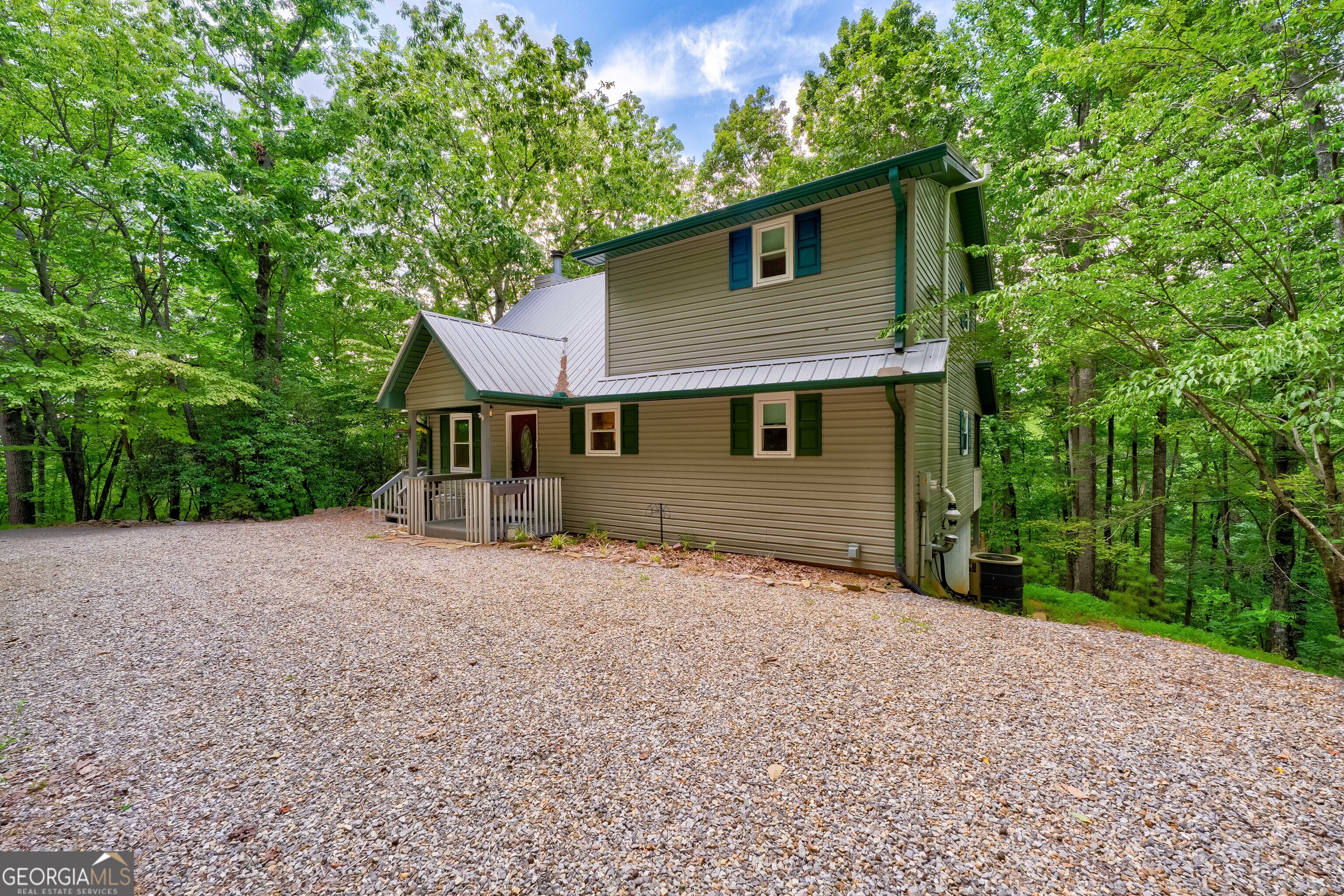 708 Wilson Mountain Road Blairsville, GA 30512 - Photo 47 of 48 a front view of a house with a garden
