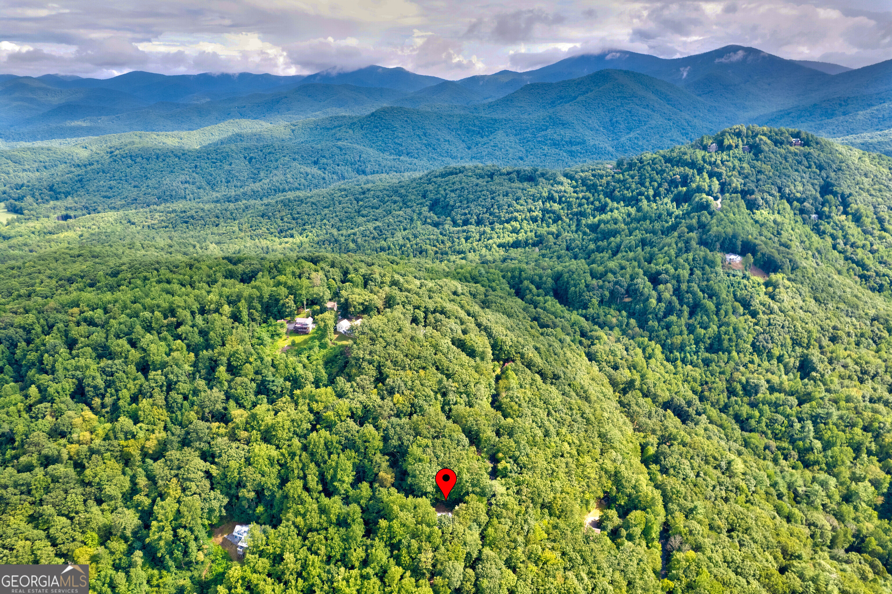 708 Wilson Mountain Road Blairsville, GA 30512 - Photo 6 of 48 a view of a lush green field with a mountain in the background