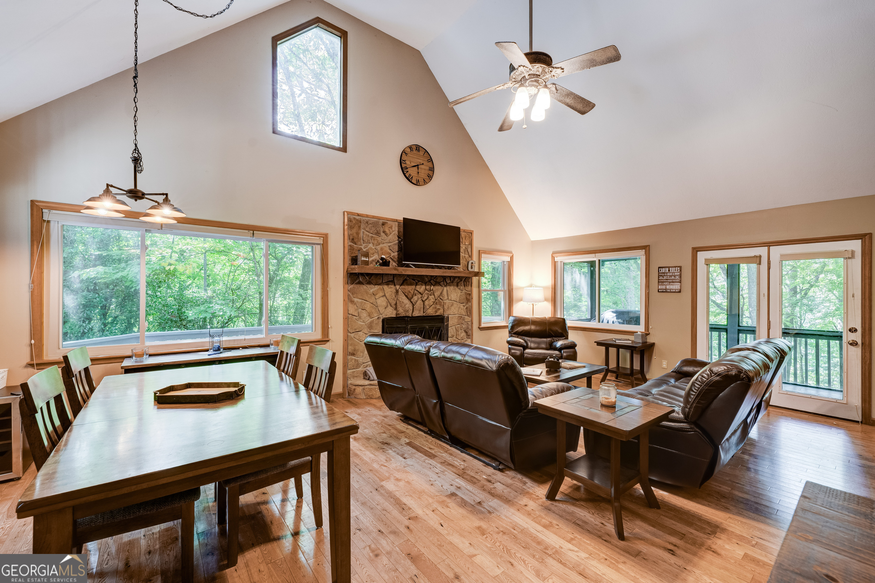 708 Wilson Mountain Road Blairsville, GA 30512 - Photo 10 of 48 a living room with furniture a fireplace and a flat screen tv