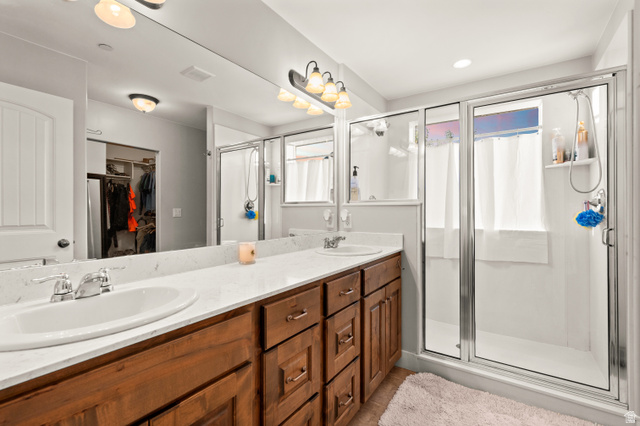 1145 North Christley Lane, Unit 48 Elk Ridge, UT 84651 - Photo 14 of 38 Master bathroom featuring a dual vanity with wood-finish cabinetry and light-toned countertops