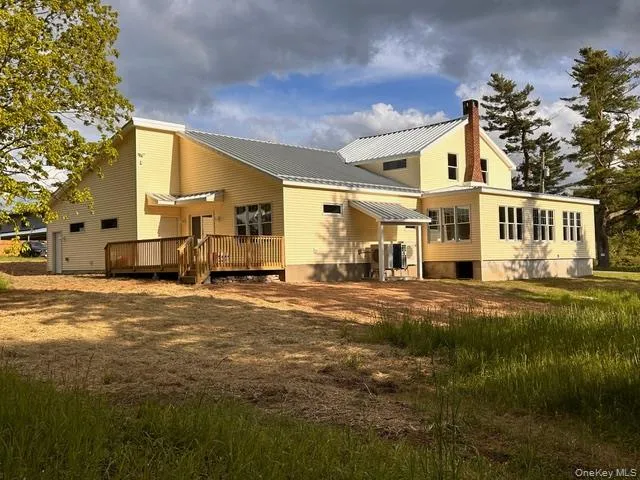 a view of deck and space with wooden fence
