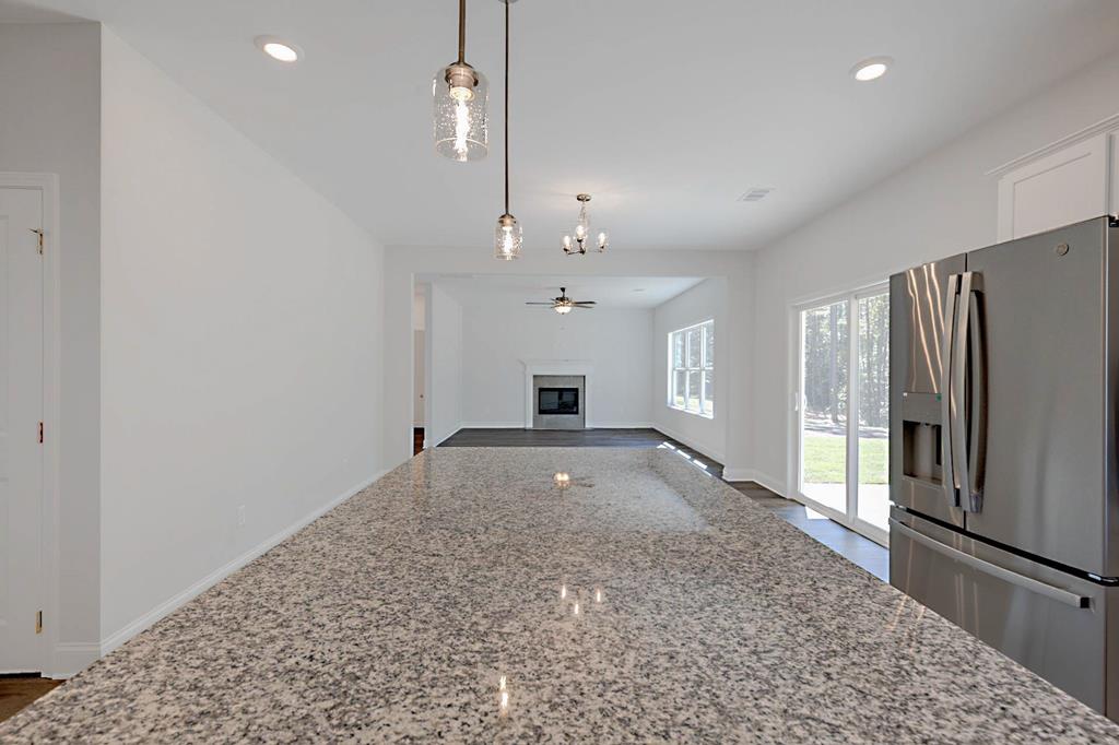 8705 McKee Road Upatoi, GA 31829 - Photo 22 of 42 a view of an empty room with a fireplace