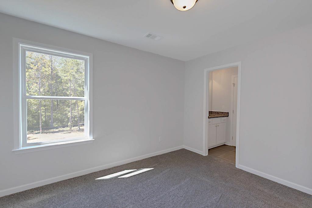 8705 McKee Road Upatoi, GA 31829 - Photo 27 of 42 a view of an empty room with a window