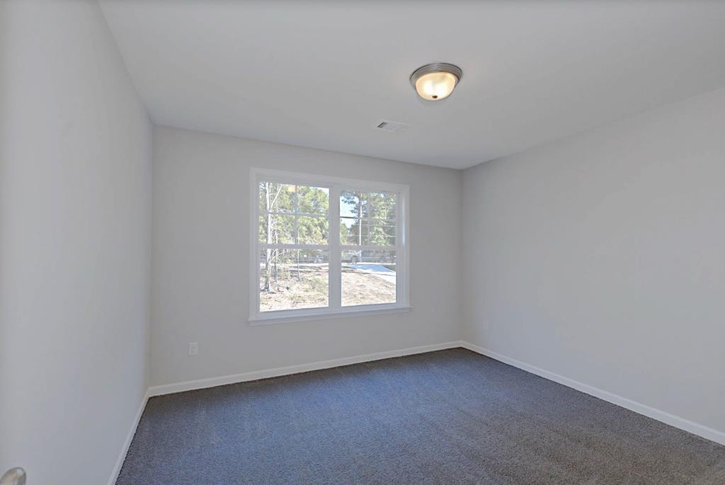 8705 McKee Road Upatoi, GA 31829 - Photo 29 of 42 an empty room with a window