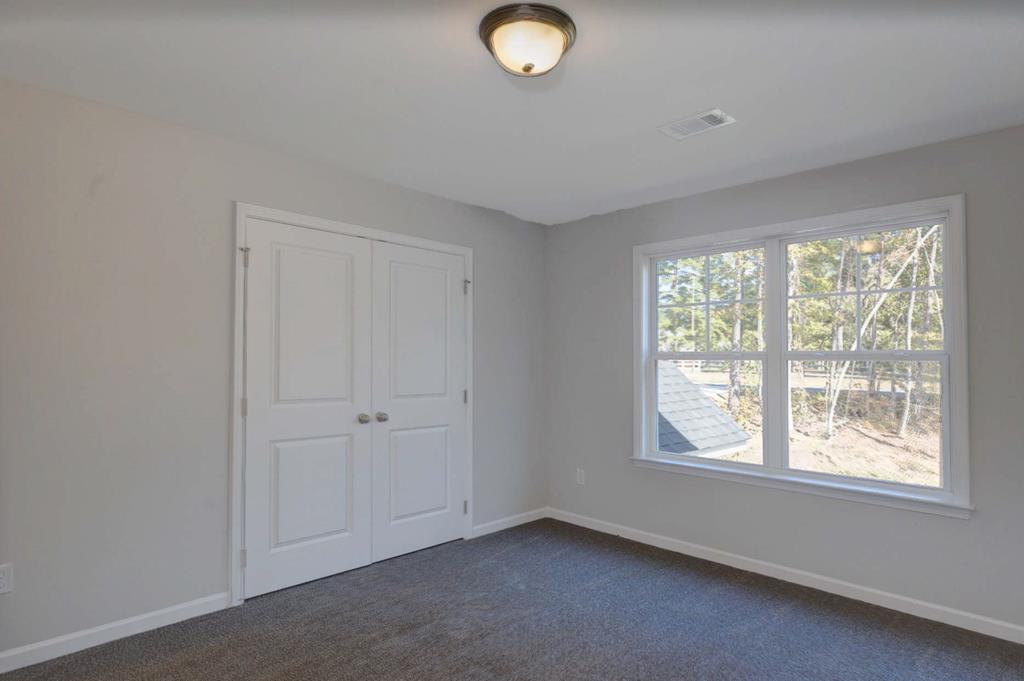 8705 McKee Road Upatoi, GA 31829 - Photo 31 of 42 an empty room with windows