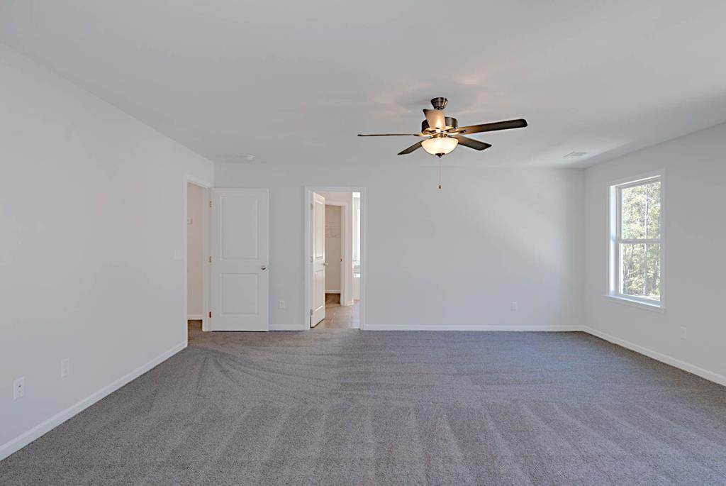 8705 McKee Road Upatoi, GA 31829 - Photo 34 of 42 an empty room with fan and windows