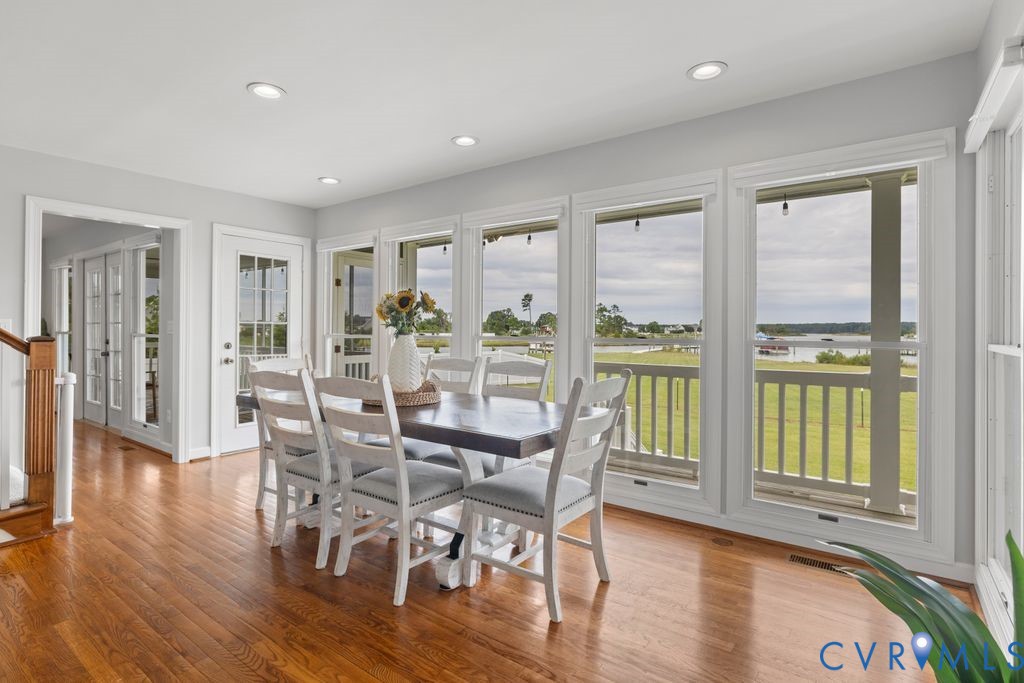 2082 Ocran Road White Stone, VA 22578 - Photo 13 of 50 a view of a dining room with furniture window and wooden floor