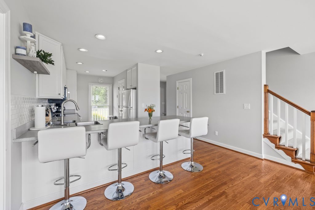 2082 Ocran Road White Stone, VA 22578 - Photo 15 of 50 a living room with furniture a wooden floor and next to a window