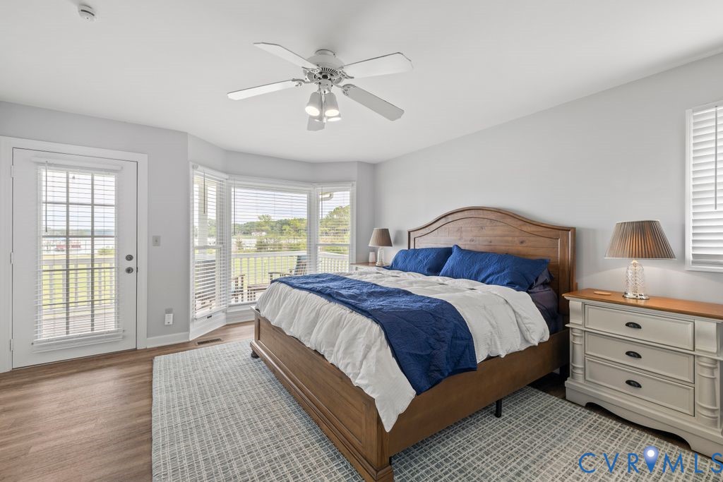2082 Ocran Road White Stone, VA 22578 - Photo 19 of 50 a bedroom with a large bed and a window
