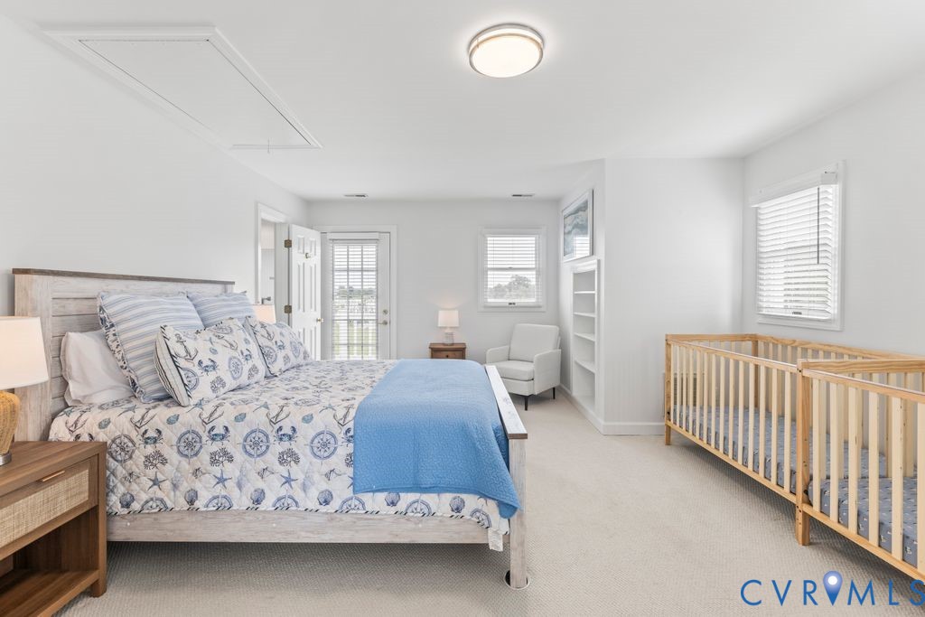 2082 Ocran Road White Stone, VA 22578 - Photo 24 of 50 a bedroom with a large bed and a window