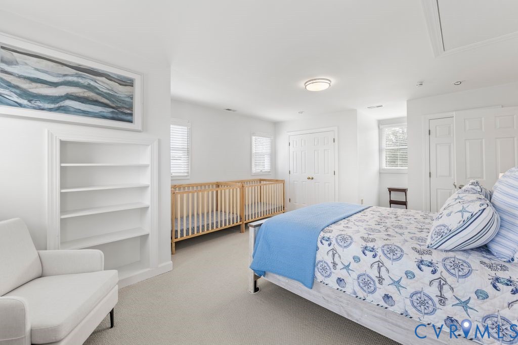 2082 Ocran Road White Stone, VA 22578 - Photo 25 of 50 a bedroom with a bed and a couch