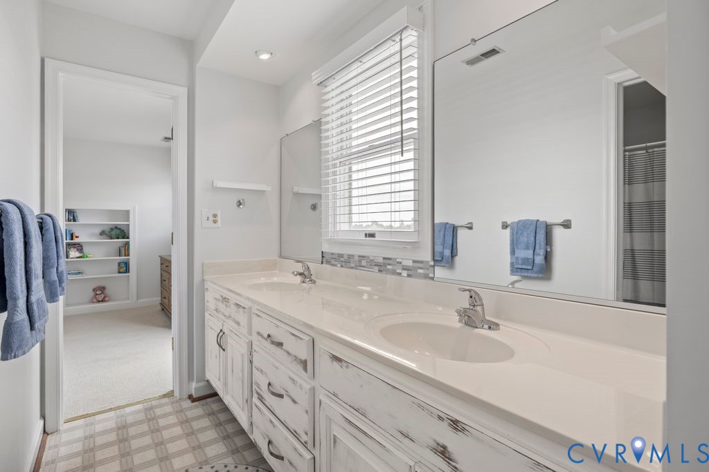2082 Ocran Road White Stone, VA 22578 - Photo 26 of 50 a bathroom with a sink double vanity and a mirror