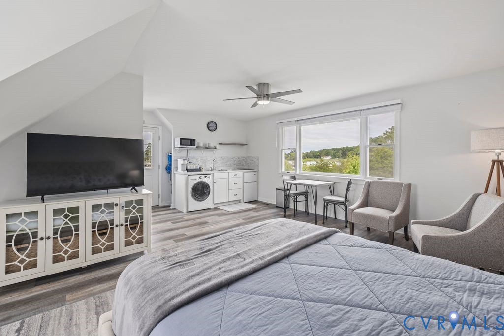 2082 Ocran Road White Stone, VA 22578 - Photo 31 of 50 a bedroom with furniture and a flat screen tv