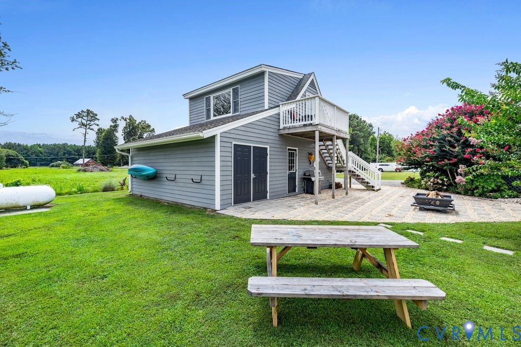 2082 Ocran Road White Stone, VA 22578 - Photo 36 of 50 a view of a house with a yard porch and sitting area