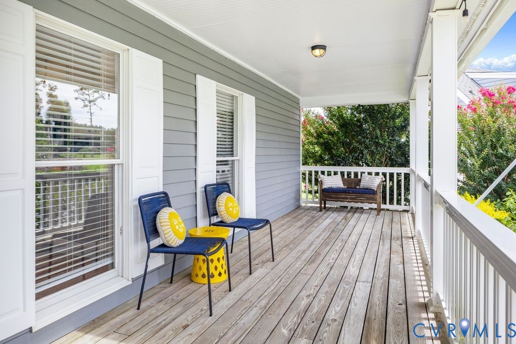 2082 Ocran Road White Stone, VA 22578 - Photo 4 of 50 a view of a deck with table and chairs and wooden floor