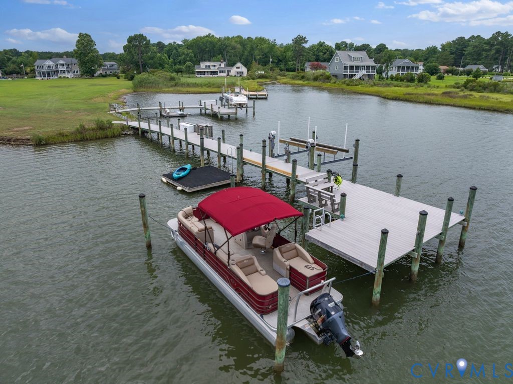 2082 Ocran Road White Stone, VA 22578 - Photo 45 of 50 a view of a lake with a table and chairs