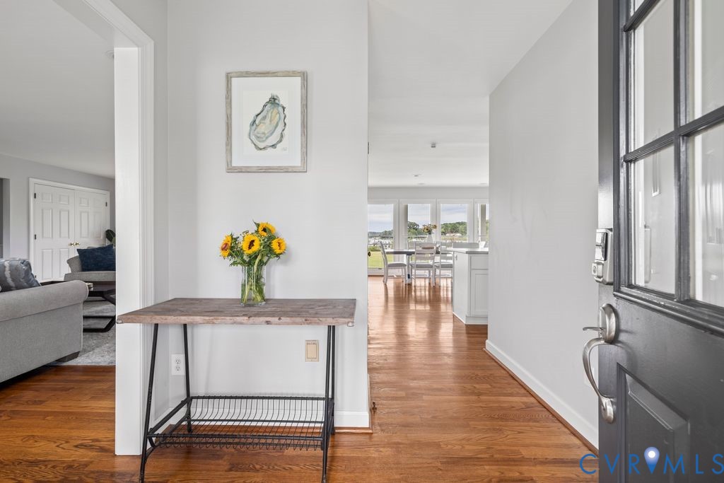 2082 Ocran Road White Stone, VA 22578 - Photo 9 of 50 a hallway with wooden floor and furniture