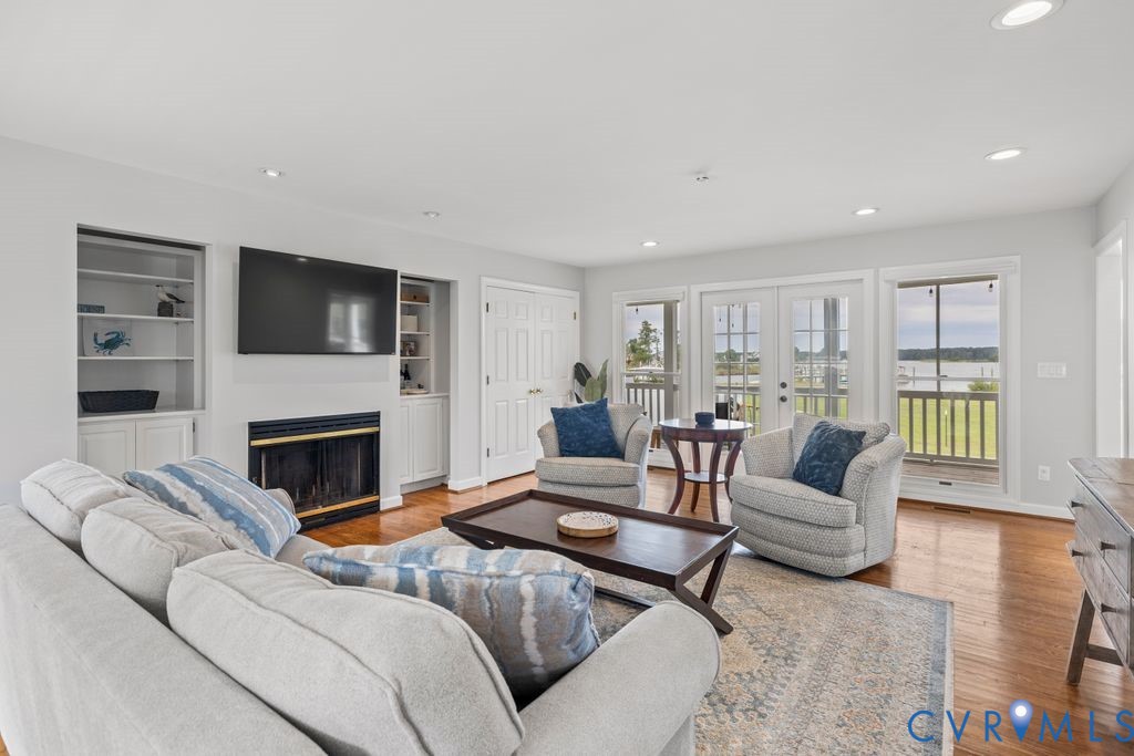 2082 Ocran Road White Stone, VA 22578 - Photo 10 of 50 a living room with furniture and a fireplace