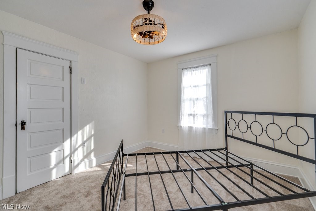 12 South 4th Street Rittman, OH 44270 - Photo 33 of 48 Unfurnished bedroom with carpet floors and baseboards